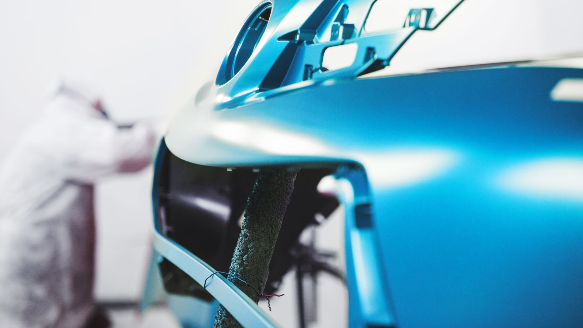 Close-up of sleek blue vehicle with reflective metallic surface